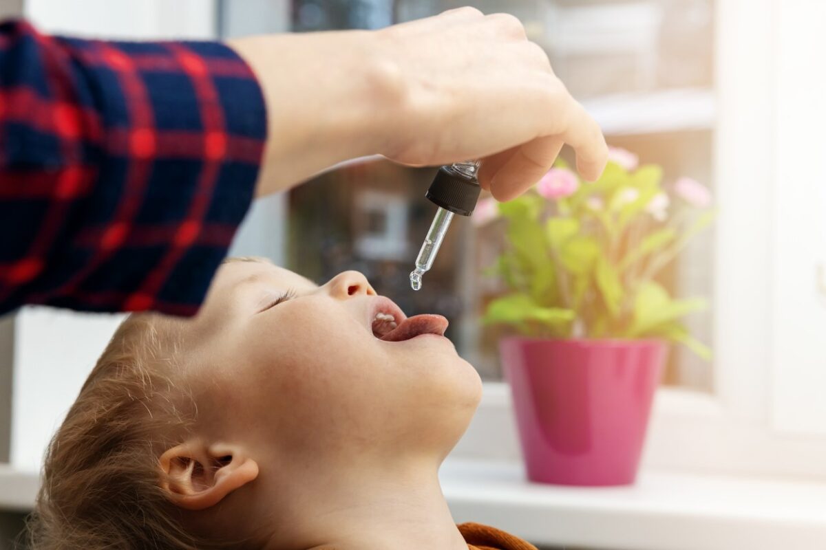 Mother-gives-child-Vit-D-1200x800.jpg